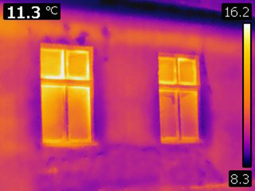 infrared thermal photo of house outer wall with two windows